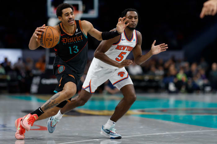 Washington Wizards guard Jordan Poole (13) drives to the basket as New York Knicks guard Immanuel Quickley (5) defends in the third quarter at Capital One Arena.